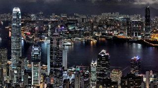City skyline night water background 6 - a large city in the background free wallpaper