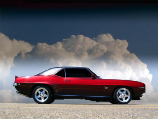 Red car parking lot cloudy 2 - a black car in the foreground free wallpaper