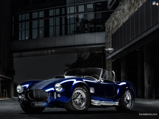 Blue sports car night building - a black roof free wallpaper