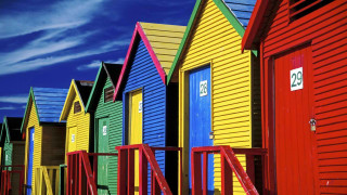 Colorful beach huts blue sky - art free wallpaper for desktop