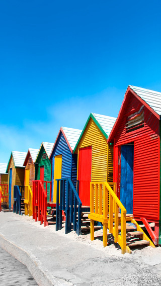 Colorful beach huts blue sky 2 - synchromism free wallpaper