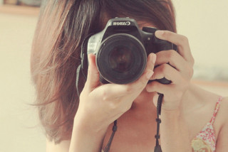 Woman taking picture camera selfie - a picture of herself free wallpaper