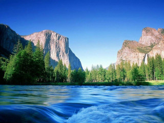 River mountain trees blue sky 2 - a mountain in the background and trees free wallpaper