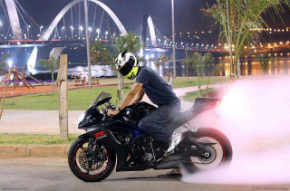 Man motorcycle night street bridge - a bridge in the background free wallpaper