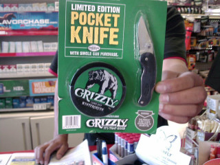 Person holding green package knife - a person holding free wallpaper