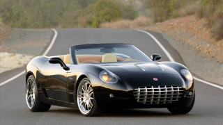 Black sports car driving forest 2 - a road next free wallpaper