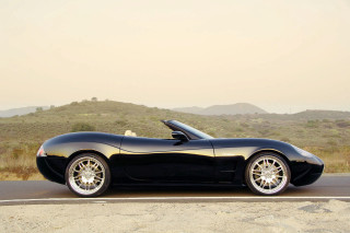 Black sports car hill mountain - a mountain in the background and a sky free wallpaper