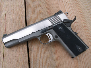Gun wooden surface black handle - a stipple free wallpaper