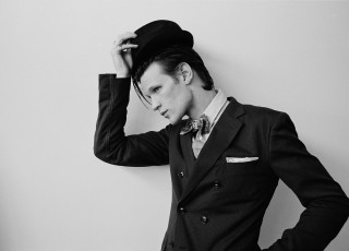 Man suit hat leaning wall - a man in a suit and hat free wallpaper