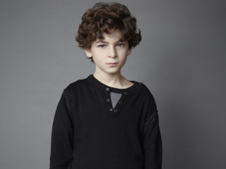 Young boy black shirt gray - a young boy free wallpaper
