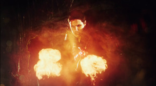 Man holding fireballs serious look - serious free wallpaper for desktop