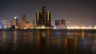City skyline night water reflections - a body of water in front free wallpaper