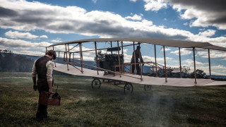Man standing small airplane grass - a small airplane free wallpaper