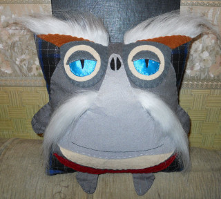 Stuffed blue nose couch pillow - a long nose free wallpaper