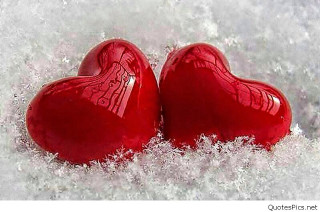 Two red hearts sitting in 2 - the snow together free wallpaper
