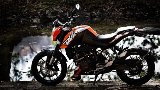 Motorcycle parked water dirt road - near free wallpaper