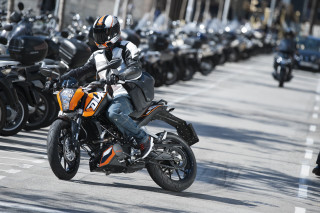 Man riding motorcycle street parking - a motorcycle free wallpaper