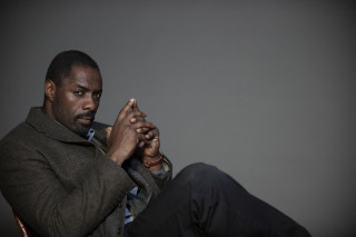 Man sitting chair serious look - his face free wallpaper