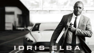 Man in suit afrofuturism poster - a building in the background free wallpaper