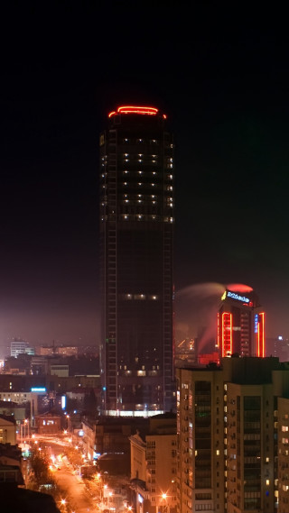 City skyline night lit tower - a red neon sign free wallpaper