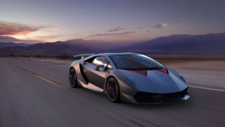 Silver sports car sunset mountains - a cloudy sky free wallpaper