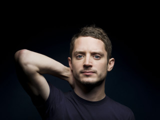 Man black shirt black background 3 - a portrait free wallpaper