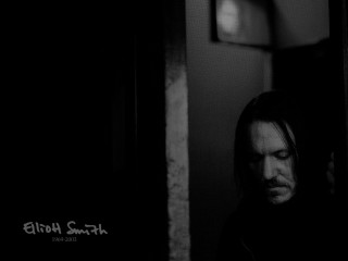 Man long hair doorway looking - studio portrait free wallpaper