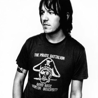 Man long hair black shirt 8 - studio portrait free wallpaper