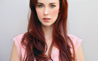 Red haired woman pink shirt - a pink shirt free wallpaper