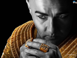 Man gold outfit holding ring - egyptian art free wallpaper
