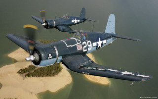 Airplanes flying over small island - a small island free wallpaper