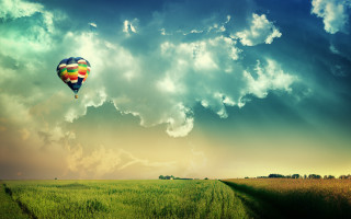 Hot air balloon over lush - a hot air balloon free wallpaper