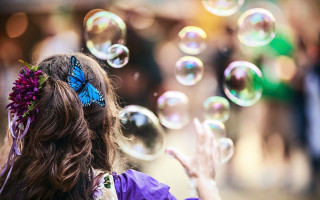 Girl butterfly bubbles crowd happiness - a crowd of people free wallpaper
