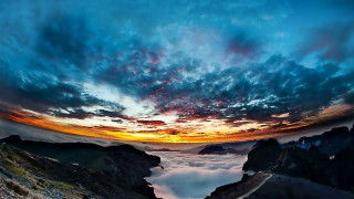 Mountain sunset clouds background view - a view of a mountain free wallpaper