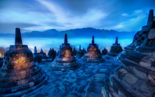 Stone structures grass cloudy sky - andrew law free wallpaper