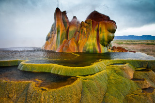 Large rock formation water middle - a large rock formation in the middle of it free wallpaper