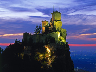 Castle lit night hill sky - a castle free wallpaper