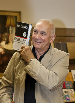Man holding book smiling camera - david lazar free wallpaper