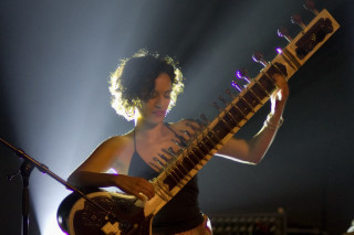 Woman playing guitar concert microphone - a woman playing free wallpaper