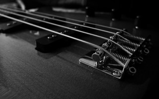 Guitar closeup black background black 2 - a close up of a guitar free wallpaper