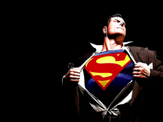Man holding superman symbol looking - heroic free wallpaper