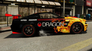 Flaming car driving street building - a street next free wallpaper