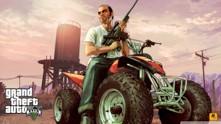 Man riding four wheeler gun - his hand and a gun free wallpaper