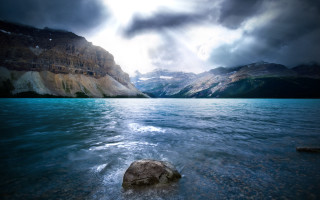 Large rock lake cloudy sky 2 - top of a lake under a cloudy sky free wallpaper