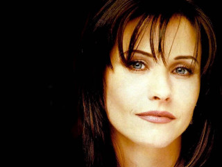 Woman blueeyes serious bangs brownhair - her face and shoulder free wallpaper