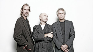 Three men arms crossed white - a white wall free wallpaper