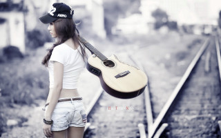 Woman guitar traintrack hat portrait 2 - her head and a hat free wallpaper