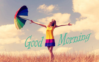 Woman holding rainbow umbrella field - anne dunn free wallpaper