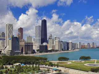 City skyline lake cloudy sky - a large city in the background free wallpaper