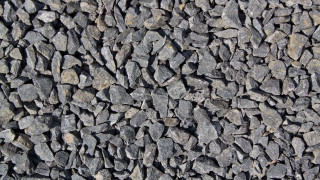 Rock wall closeup black white - constant permeke free wallpaper